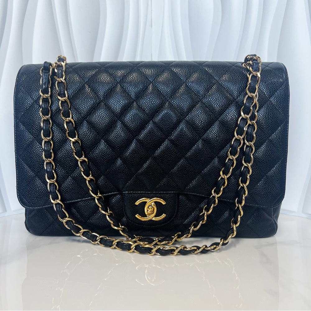 The CHANEL 2011 Maxi Classic Flap Cavier Leather Shoulder Bag with Gold Hardware